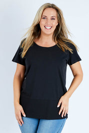 Model Jess wearing size 14 of the Fundamental Rib Short Sleeve Cotton Tee in colour Black (Black), from the front, cropped image
