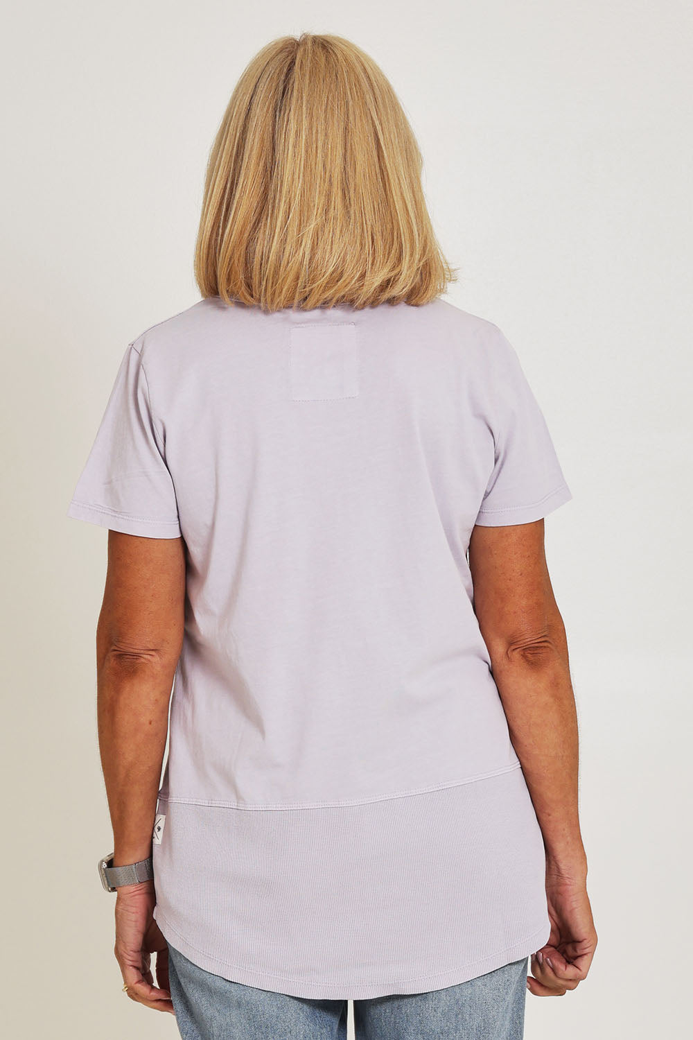 Model Sandy wearing size 10 of the Fundamental Rib Short Sleeve Cotton Tee in colour Dustylilac (Purple), from the back