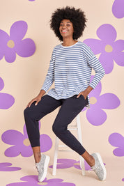 Model Aiyana wearing size 10 of the Fundamental Wash Out Pant in colour Navy (Blue), from the front, showing the whole outfit