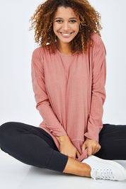 Model Summer wearing size 10 of the Fundamental Rib Long Sleeve Tee in colour DustyPink (Pink), from the front, cropped image