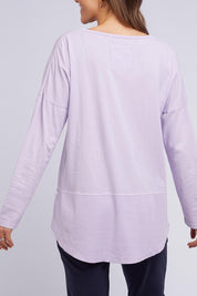 A model wearing the Fundamental Rib Long Sleeve Tee in colour Dustylilac (Purple), from the back