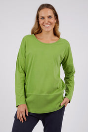 A model wearing the Fundamental Rib Long Sleeve Tee in colour Junglegre (Green), from the front, cropped image