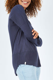 Model Summer wearing size 10 of the Fundamental Rib Long Sleeve Tee in colour Navy (Blue), from the front, cropped image