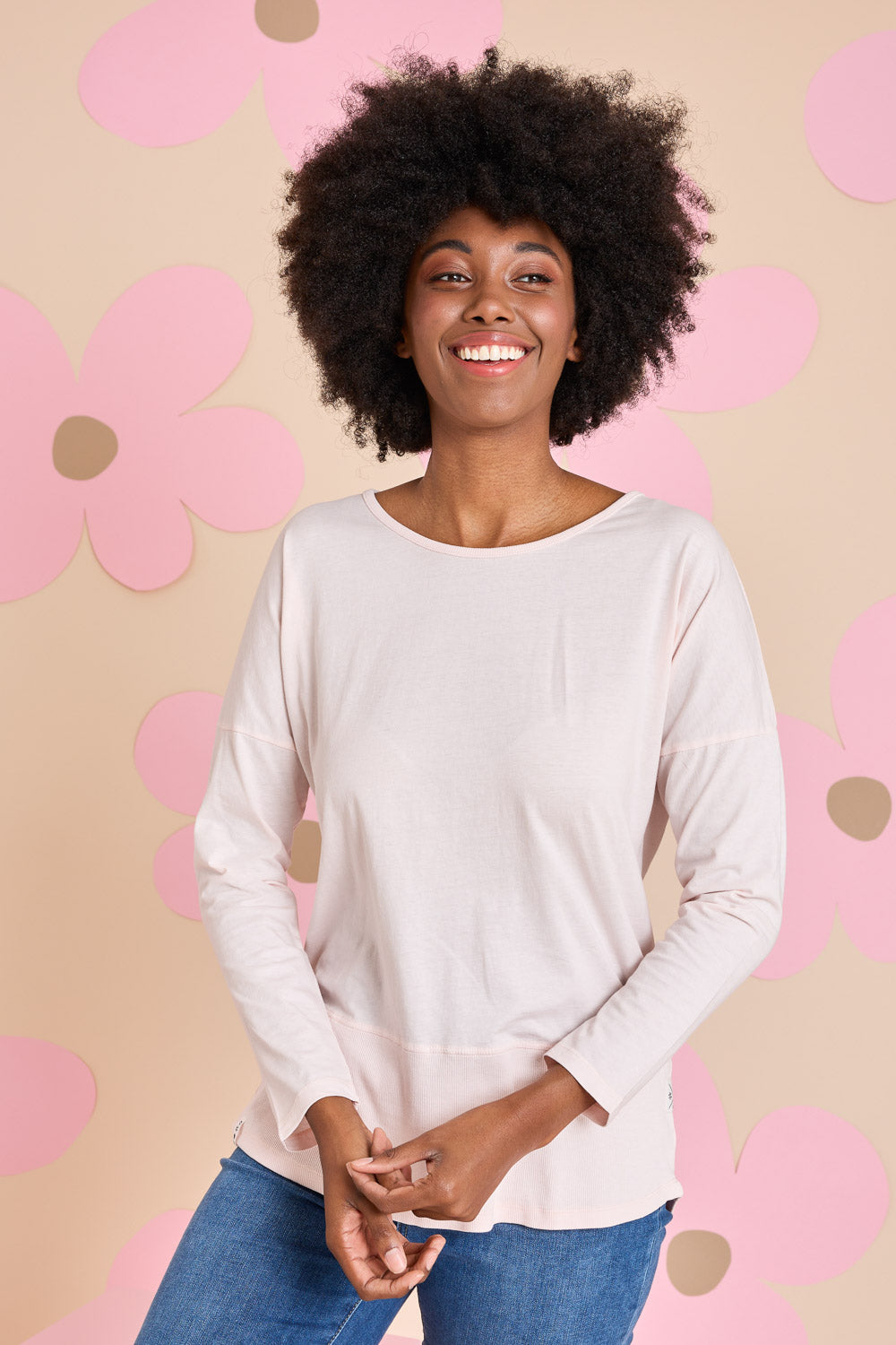 Model Aiyana wearing size 10 of the Fundamental Rib Long Sleeve Tee in colour Palepink (Pink), from the front, showing the whole outfit