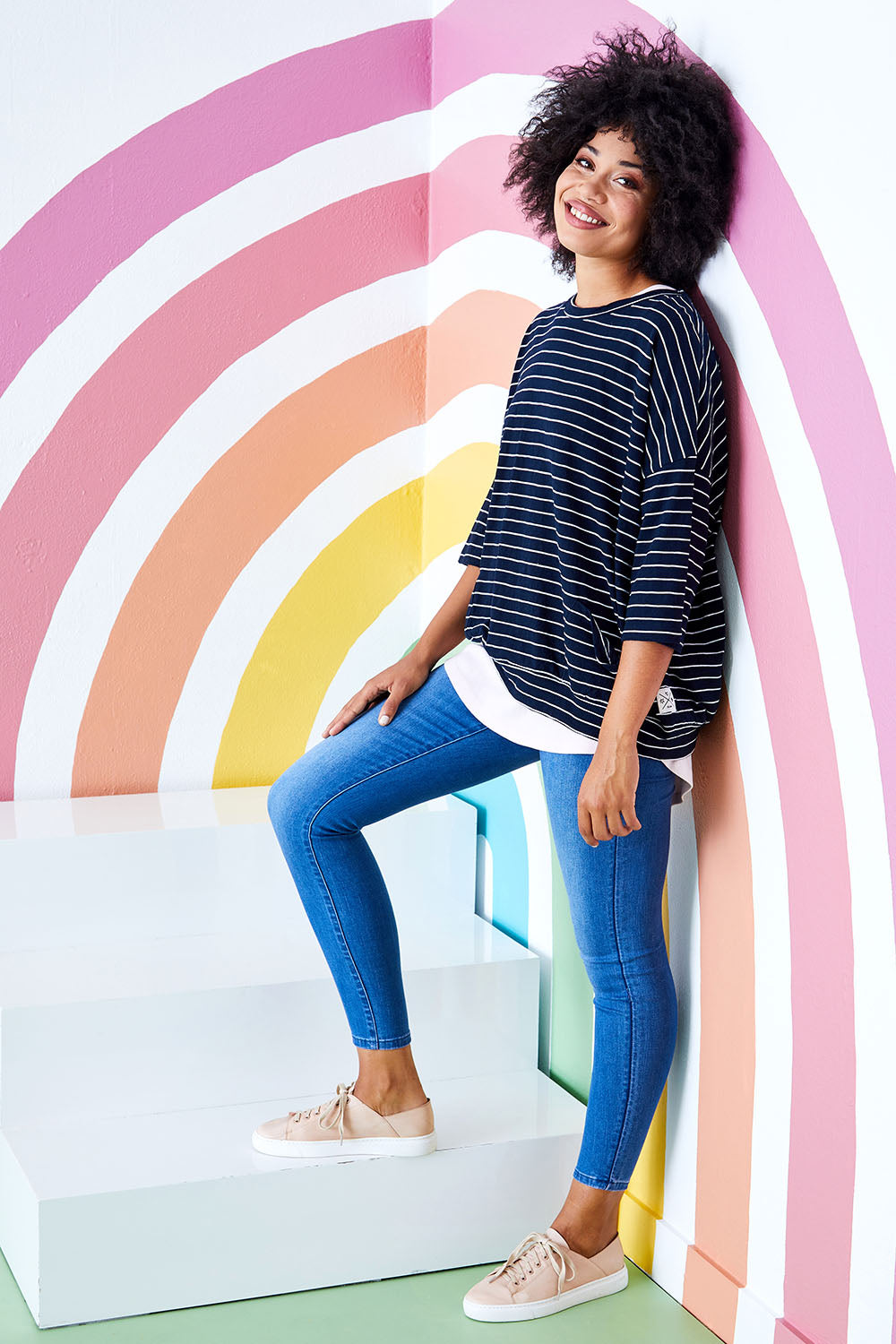 Model Olivia wearing size 10 of the Fundamental Maizie Sweat in colour Navywhite (Blue), from the front, showing the whole outfit