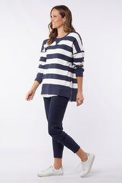 A model wearing the Fundamental Block Stripe Crew in colour Navywhite (Blue), from the front, showing the whole outfit