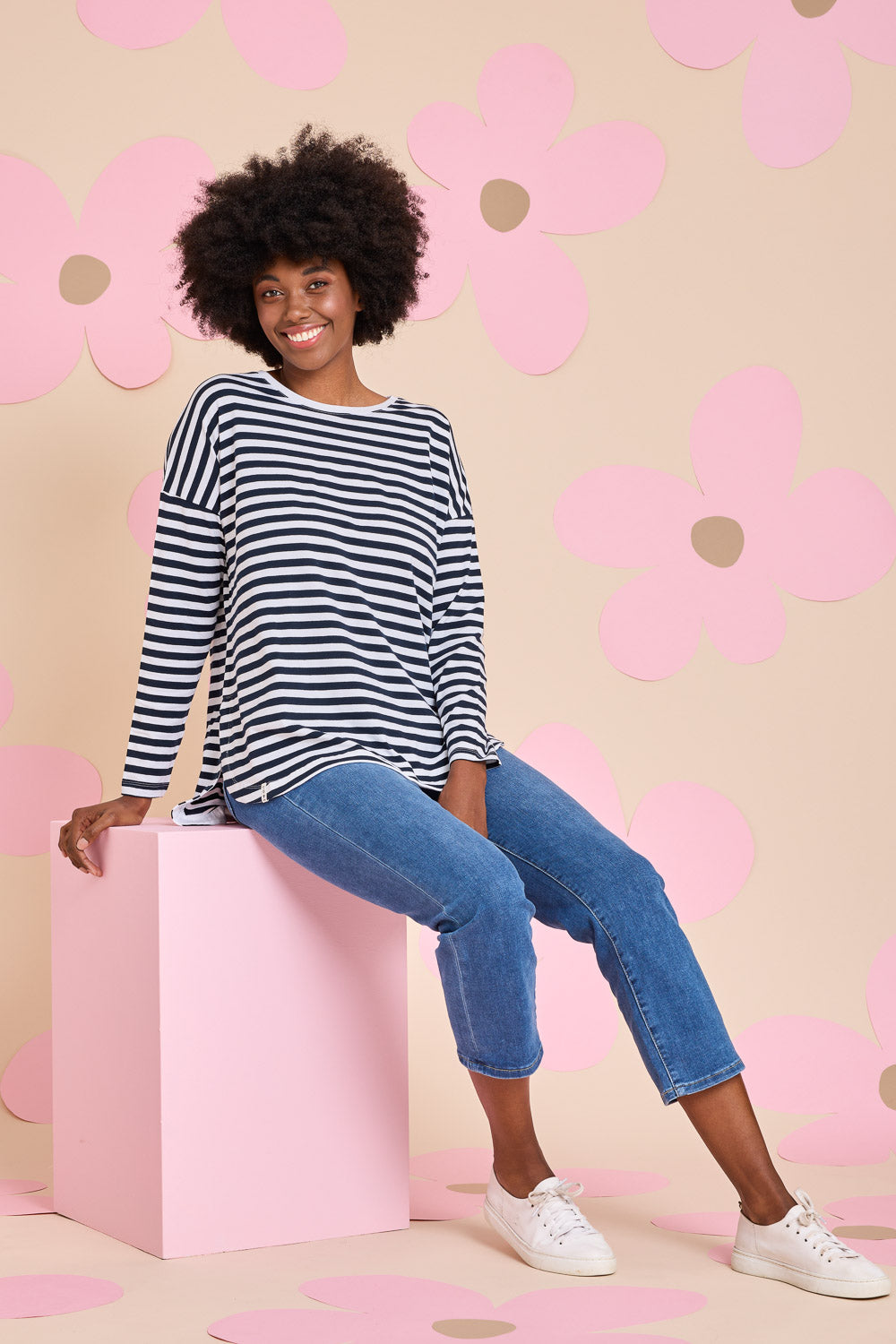 Model Aiyana wearing size 10 of the Fundamental Stripe Society L/S Tee in colour Navywhite (Blue), from the front, showing the whole outfit