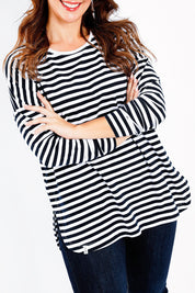 Model Jessica wearing size 14 of the Fundamental Stripe Society L/S Tee in colour Navywhite (Blue), from the front, cropped image