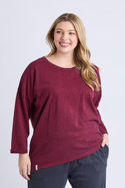A model wearing the Fundamental Annie 3/4 Sleeve Tee in colour Plum (Purple), from the front, cropped image