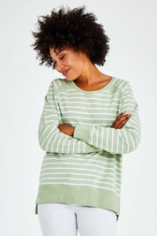 Model Olivia wearing size 10 of the Fundamental Sydney Crew in colour Greenstrip (Green), from the front, cropped image