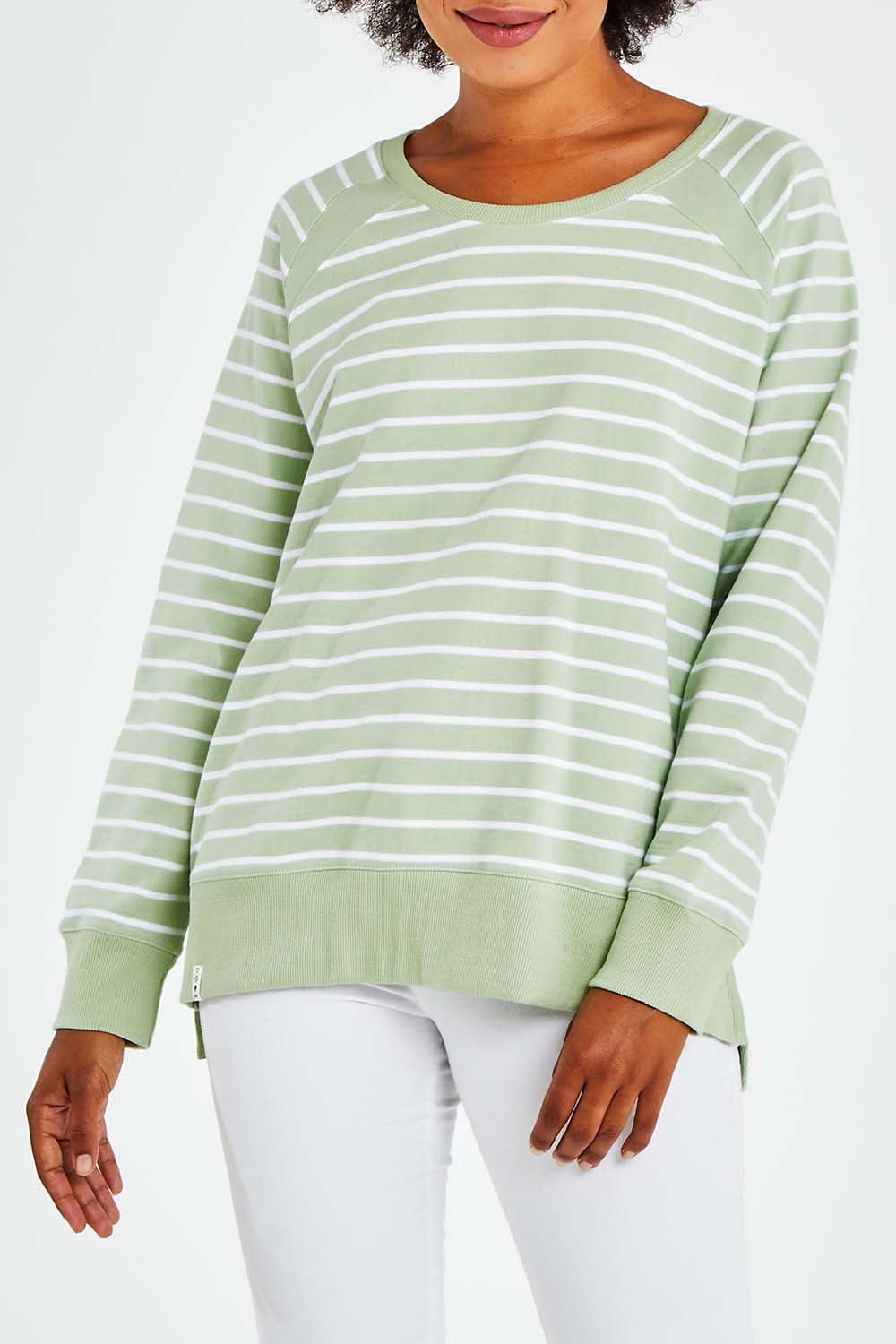 Model Olivia wearing size 10 of the Fundamental Sydney Crew in colour Greenstrip (Green), from the front, cropped image