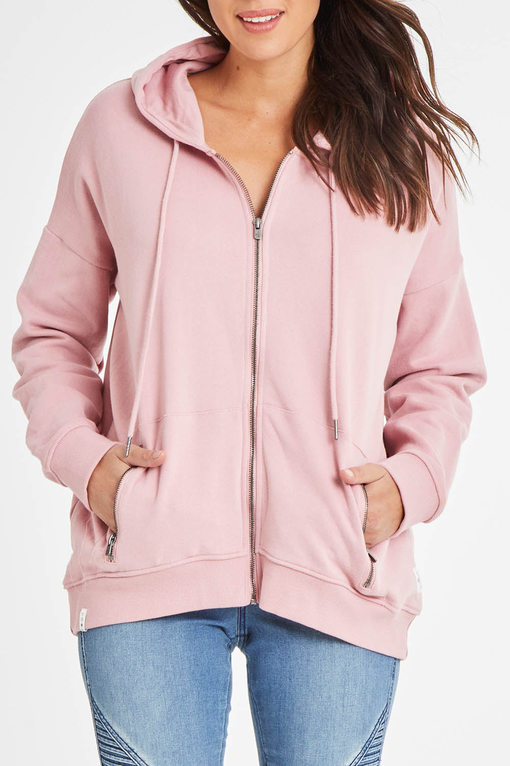 Model Madeline wearing size 10 of the Fundamentals Cosy Hoody in colour Dustypnk (Pink), from the front, cropped image