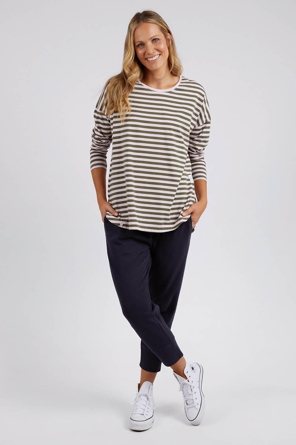 A model wearing the Fundamental Lauren Stripe LS Tee in colour Pinkkhaki (Pink), from the front, showing the whole outfit