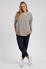 A model wearing the Fundamental Lauren Stripe LS Tee in colour Pinkkhaki (Pink), from the front, showing the whole outfit