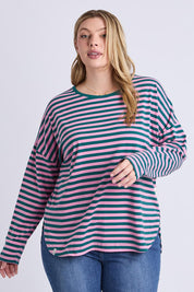 A model wearing the Fundamental Lauren Stripe LS Tee in colour Tealpink (Blue), from the front, cropped image