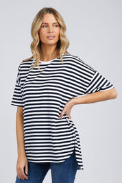 A model wearing the Fundamental Lauren S/S Cotton Stripe in colour Navywhit (Blue), from the front, cropped image