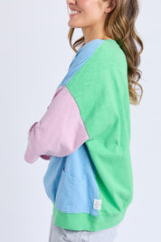 A model wearing the Fundamental Mazie Colour Block Cotton Sweat in colour Blupnkgree (Blue), from the front, cropped image