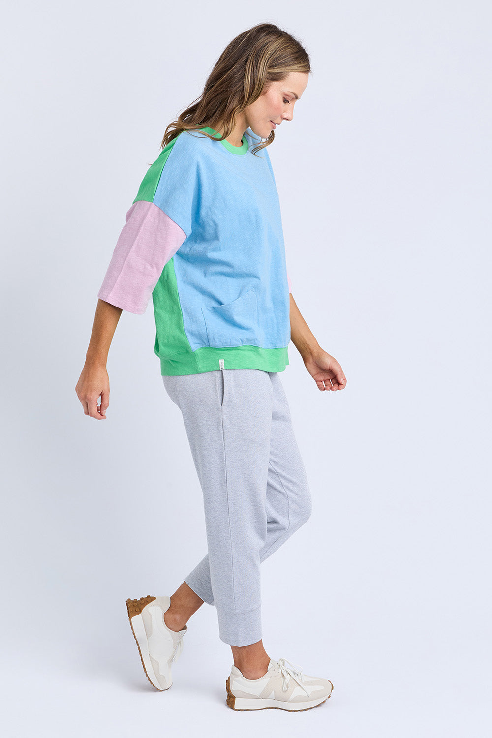 A model wearing the Fundamental Mazie Colour Block Cotton Sweat in colour Blupnkgree (Blue), from the front, showing the whole outfit