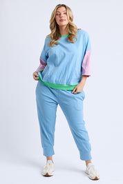A model wearing the Fundamental Mazie Colour Block Cotton Sweat in colour Blupnkgree (Blue), from the front, showing the whole outfit