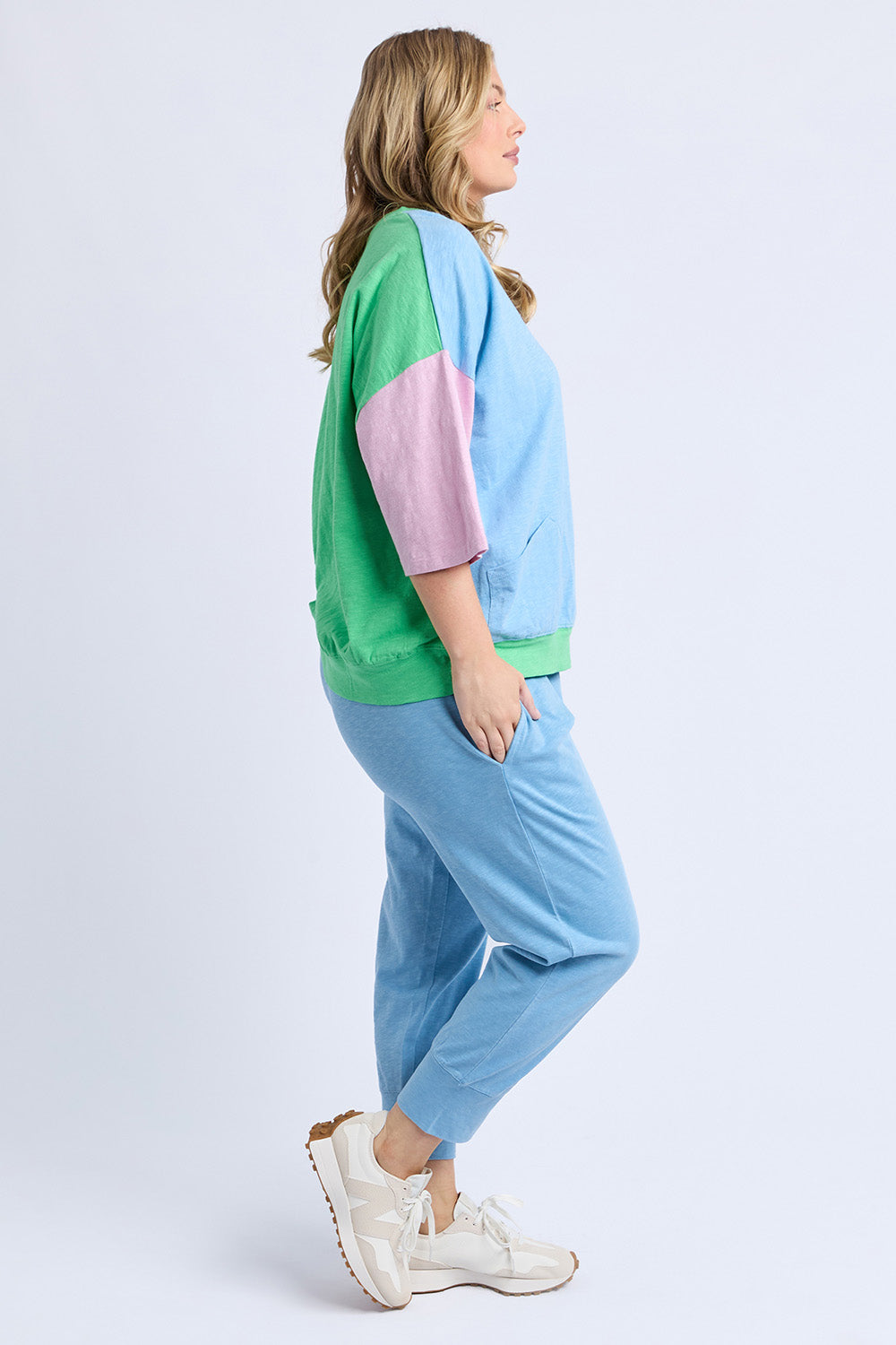 A model wearing the Fundamental Mazie Colour Block Cotton Sweat in colour Blupnkgree (Blue), from the front, showing the whole outfit