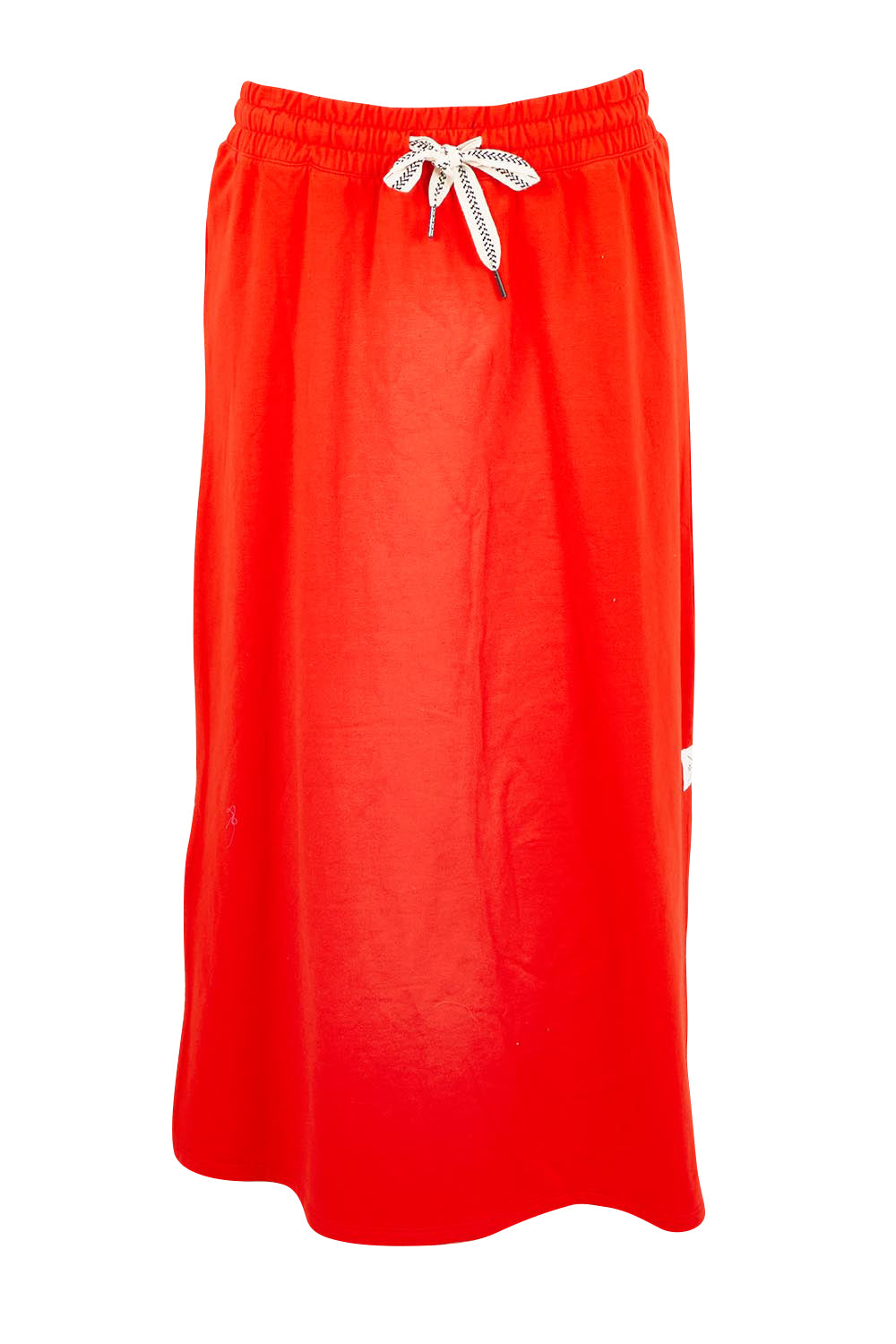 Product shot of the Fundamental Travel Skirt – Tangello in colour Tangello, from the front