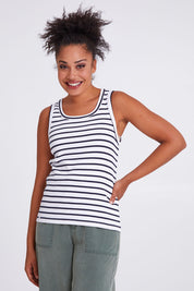 Model Olivia wearing size 10 of the Fundamental Indra Stripe Tank in colour Whitenavy (White), from the front, cropped image