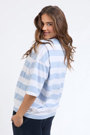 A model wearing the Fundamental Mazie Block Stripe Cotton Sweat in colour Skybluestr (Blue), from the back