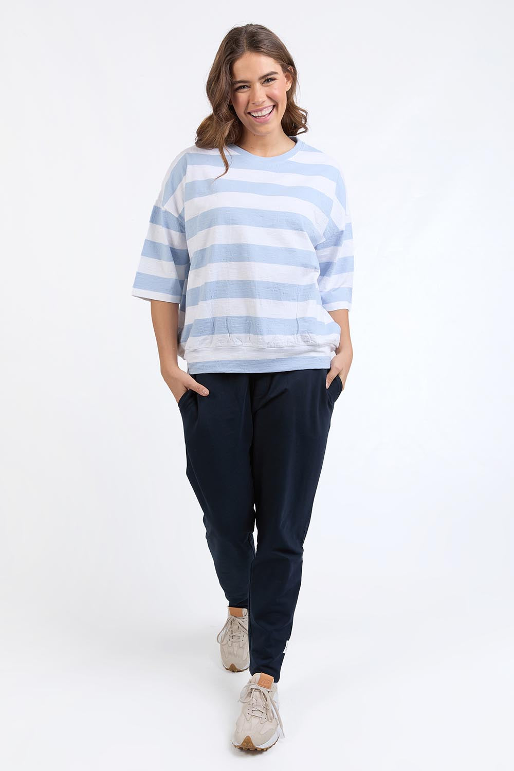 A model wearing the Fundamental Mazie Block Stripe Cotton Sweat in colour Skybluestr (Blue), from the front, showing the whole outfit