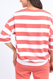A model wearing the Fundamental Mazie Block Stripe Cotton Sweat in colour Watermelon (Red), from the back