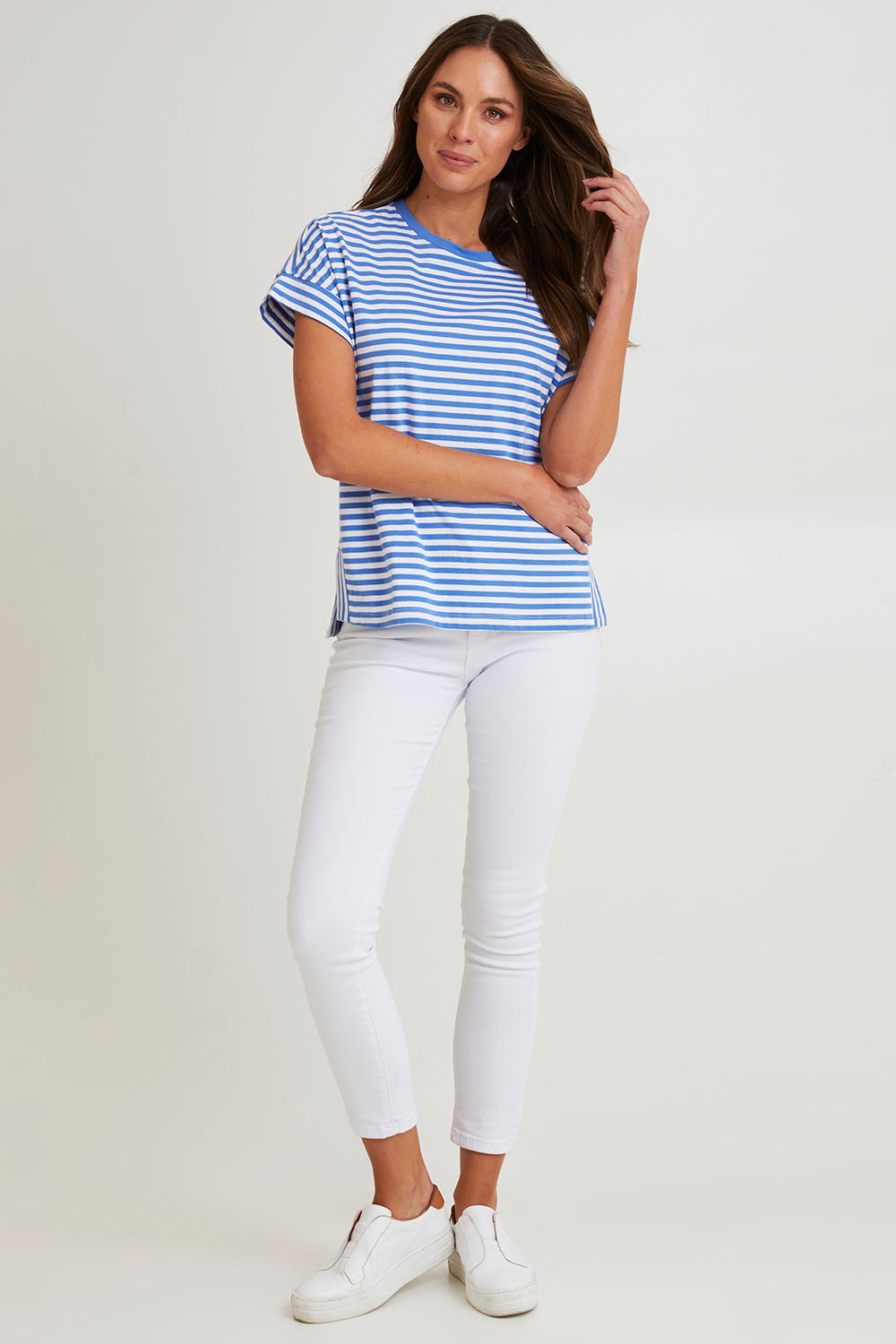 Model Madeline wearing size 10 of the Fundamental Yara Stripe Ss Tee in colour Bluewhite (Blue), from the front, showing the whole outfit