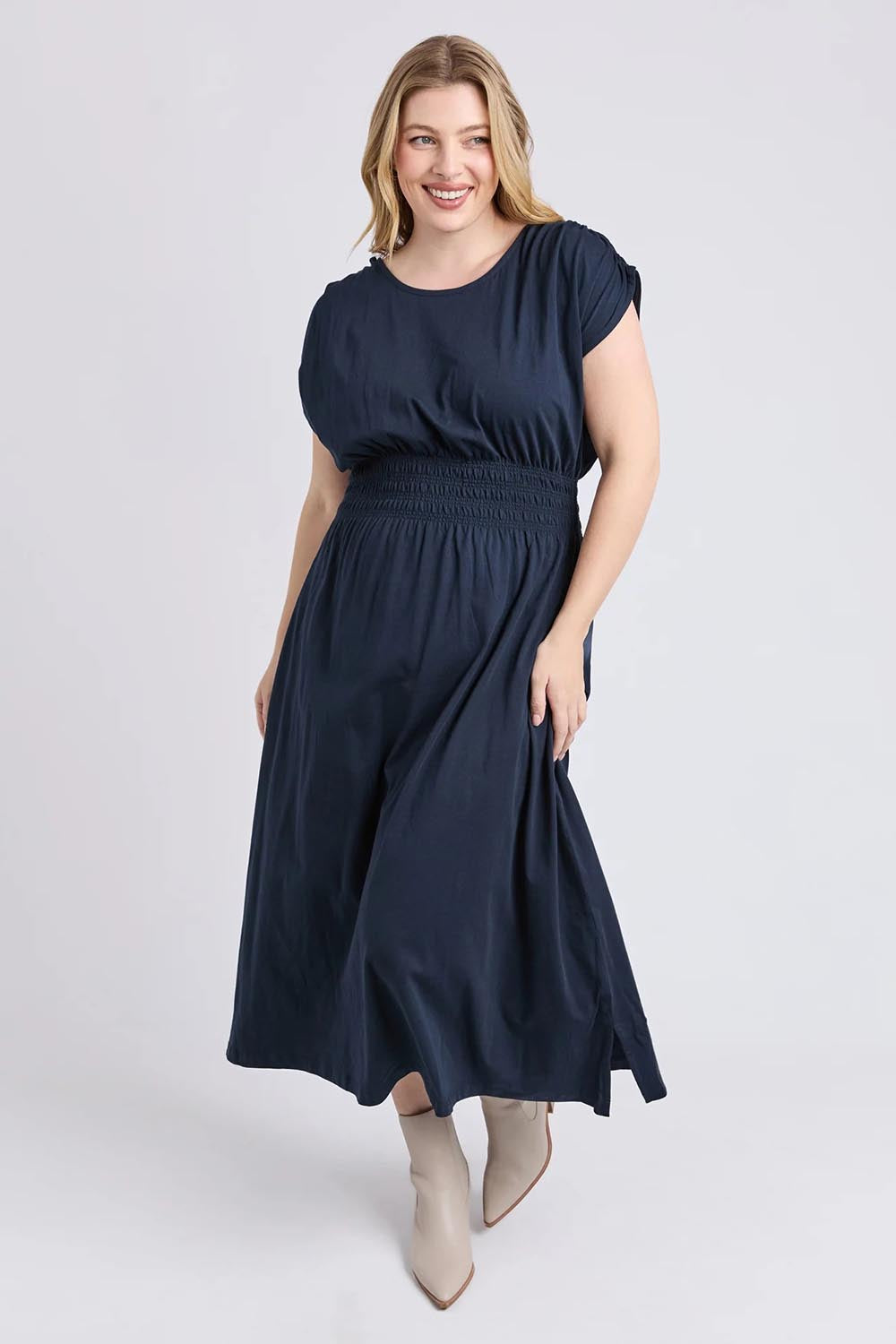 A model wearing the Fundamental Nelle Cotton Midi Dress in colour Navy (Blue), from the front, showing the whole outfit