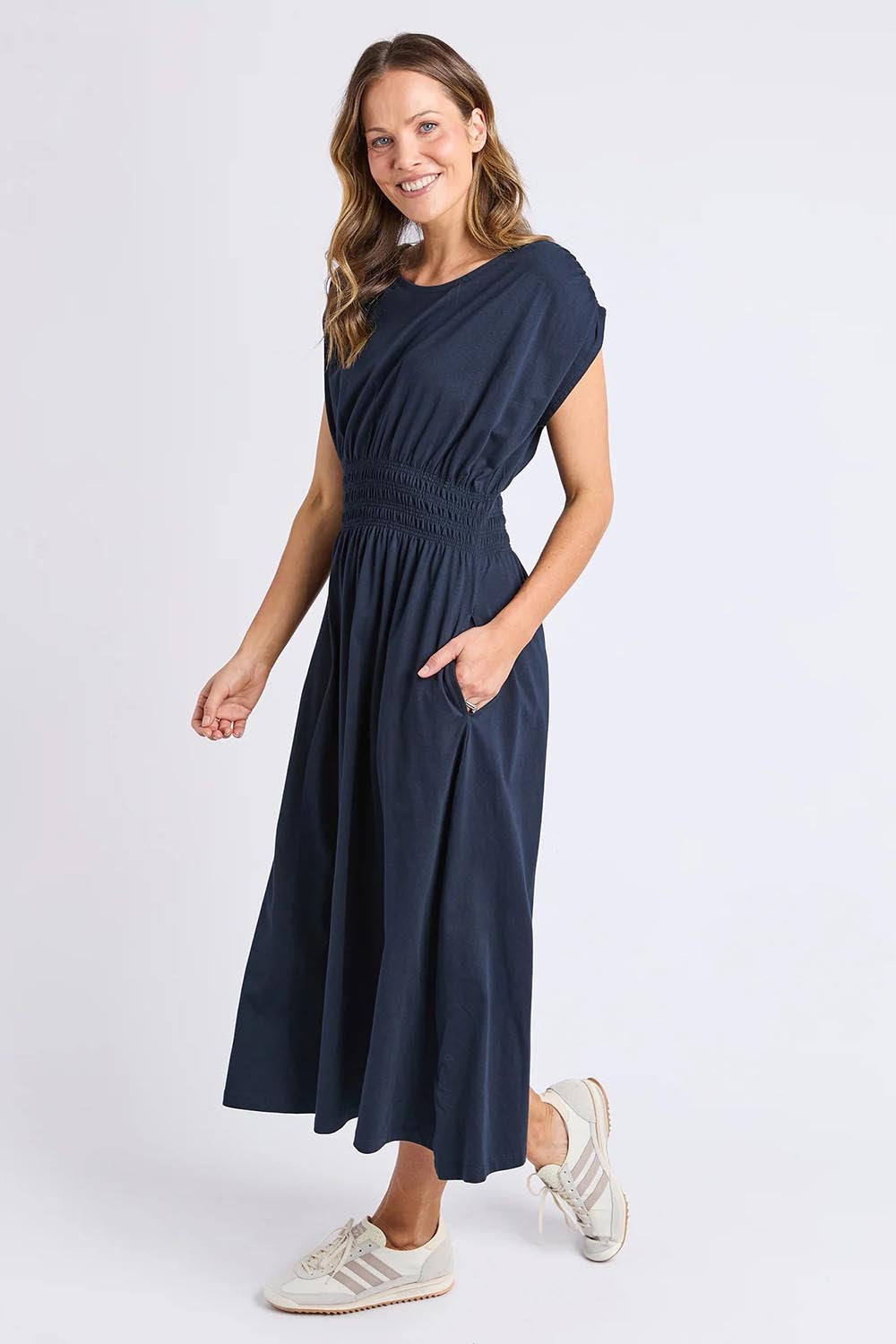 A model wearing the Fundamental Nelle Cotton Midi Dress in colour Navy (Blue), from the front, showing the whole outfit