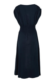 Product shot of the Fundamental Nelle Cotton Midi Dress in colour Navy (Blue), from the back