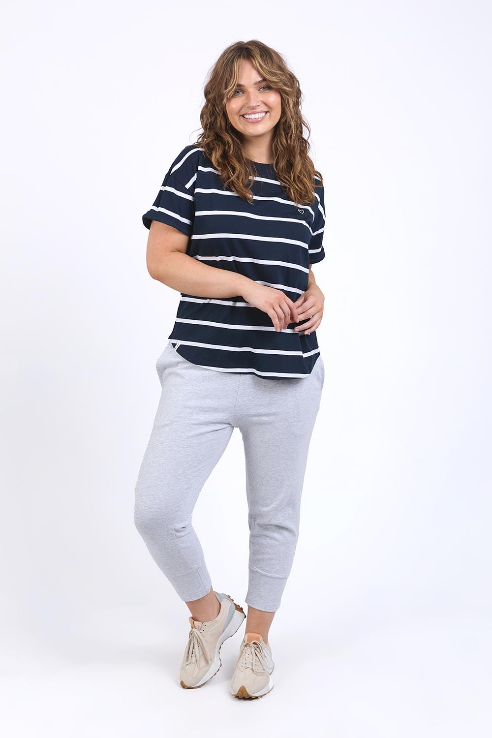 A model wearing the Fundamental Halli Cotton Short Sleeve Tee in colour Navyst (Blue), from the front, showing the whole outfit