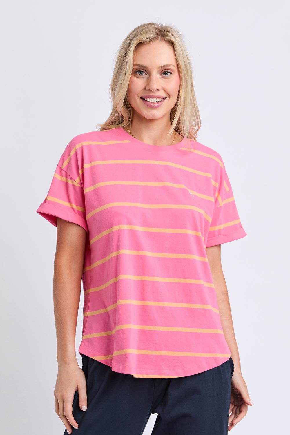 Model Genericm wearing size sample of the Fundamental Halli Cotton Short Sleeve Tee – Pinklemon in colour Pinklemon, in a cropped view