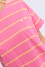Model Genericm wearing size sample of the Fundamental Halli Cotton Short Sleeve Tee – Pinklemon in colour Pinklemon, in a cropped view