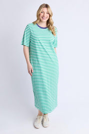 A model wearing the Fundamental Merry Cotton Tee Dress in colour Greenwhite (Blue), from the front, showing the whole outfit