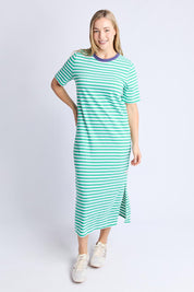 A model wearing the Fundamental Merry Cotton Tee Dress in colour Greenwhite (Blue), from the front, showing the whole outfit