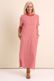 Model Sandys wearing size 10 of the Fundamental Merry Cotton Tee Dress – Tangwht in colour Tangwht, from the front