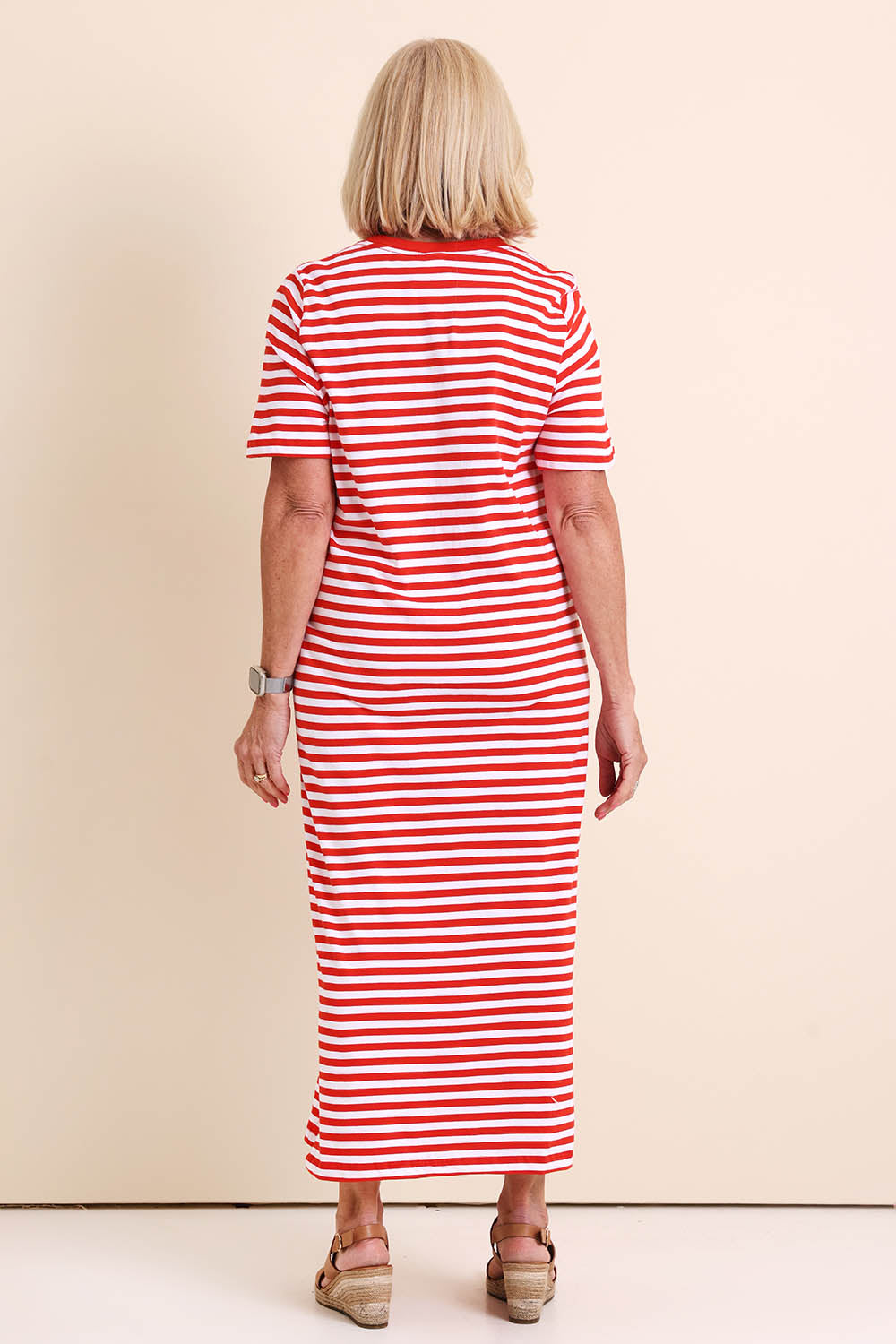 Model Sandys wearing size 10 of the Fundamental Merry Cotton Tee Dress – Tangwht in colour Tangwht, from the front