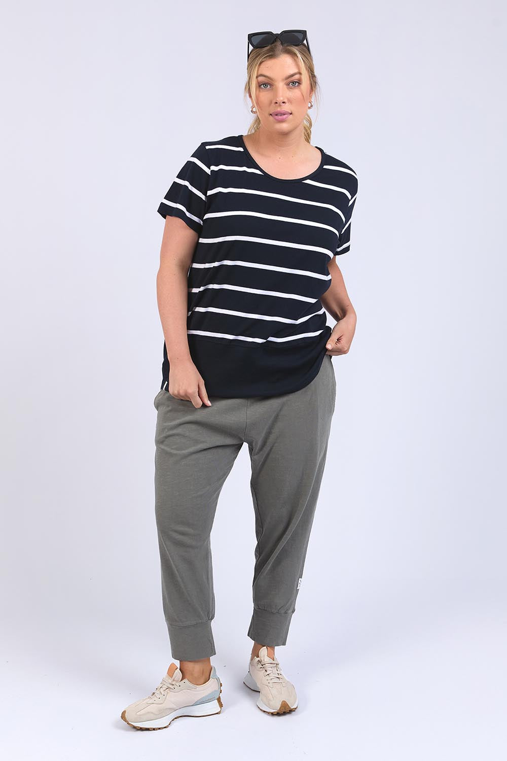 A model wearing the Fundamental Rib Short Sleeve Stripe Cotton Tee in colour Navywhite (Blue), from the front, showing the whole outfit
