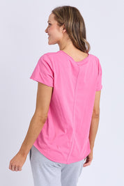 A model wearing the Fundamental Pima Cotton Vee Tee in colour Audorapink (Pink), from the back