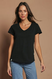 Model Madeline wearing size 10 of the Fundamental Pima Cotton Vee Tee in colour Black (Black), from the front, cropped image