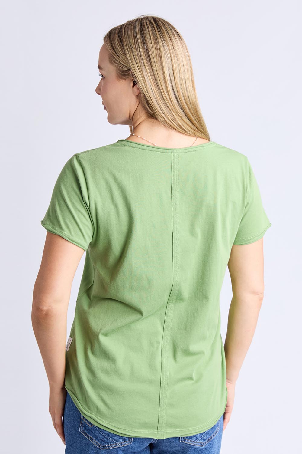 A model wearing the Fundamental Pima Cotton Vee Tee in colour Forest (Green), from the back