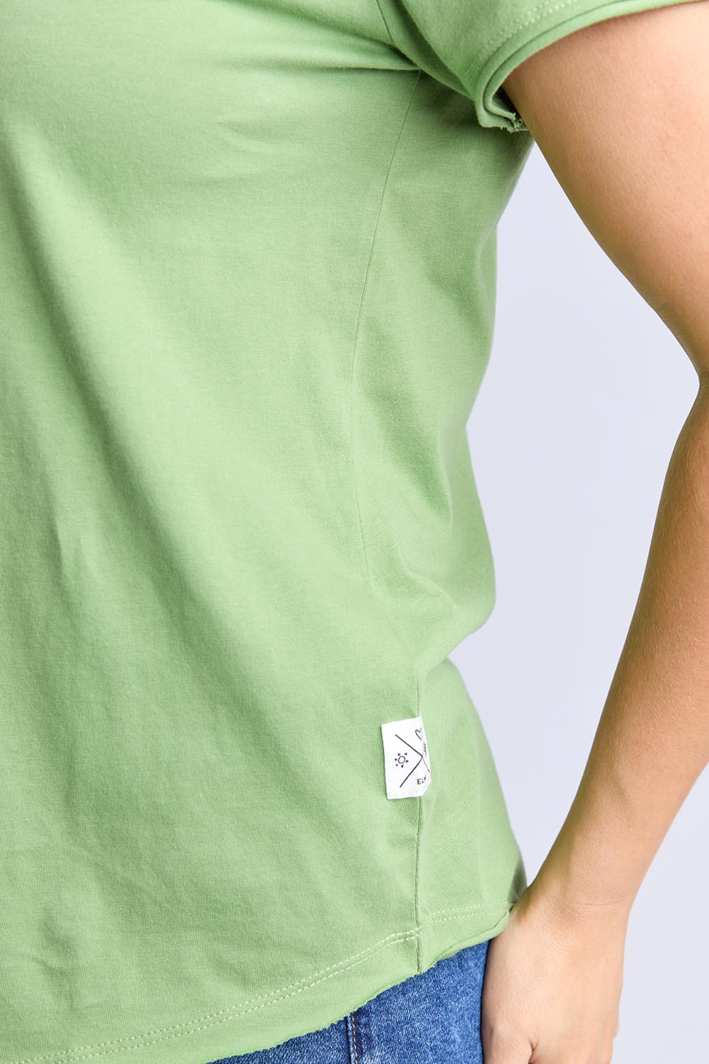 A model wearing the Fundamental Pima Cotton Vee Tee in colour Forest (Green), from the front, cropped image