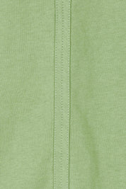 Product shot of the Fundamental Pima Cotton Vee Tee in colour Forest (Green), detail