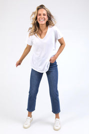A model wearing the Fundamental Pima Cotton Vee Tee in colour White (White), from the front, showing the whole outfit
