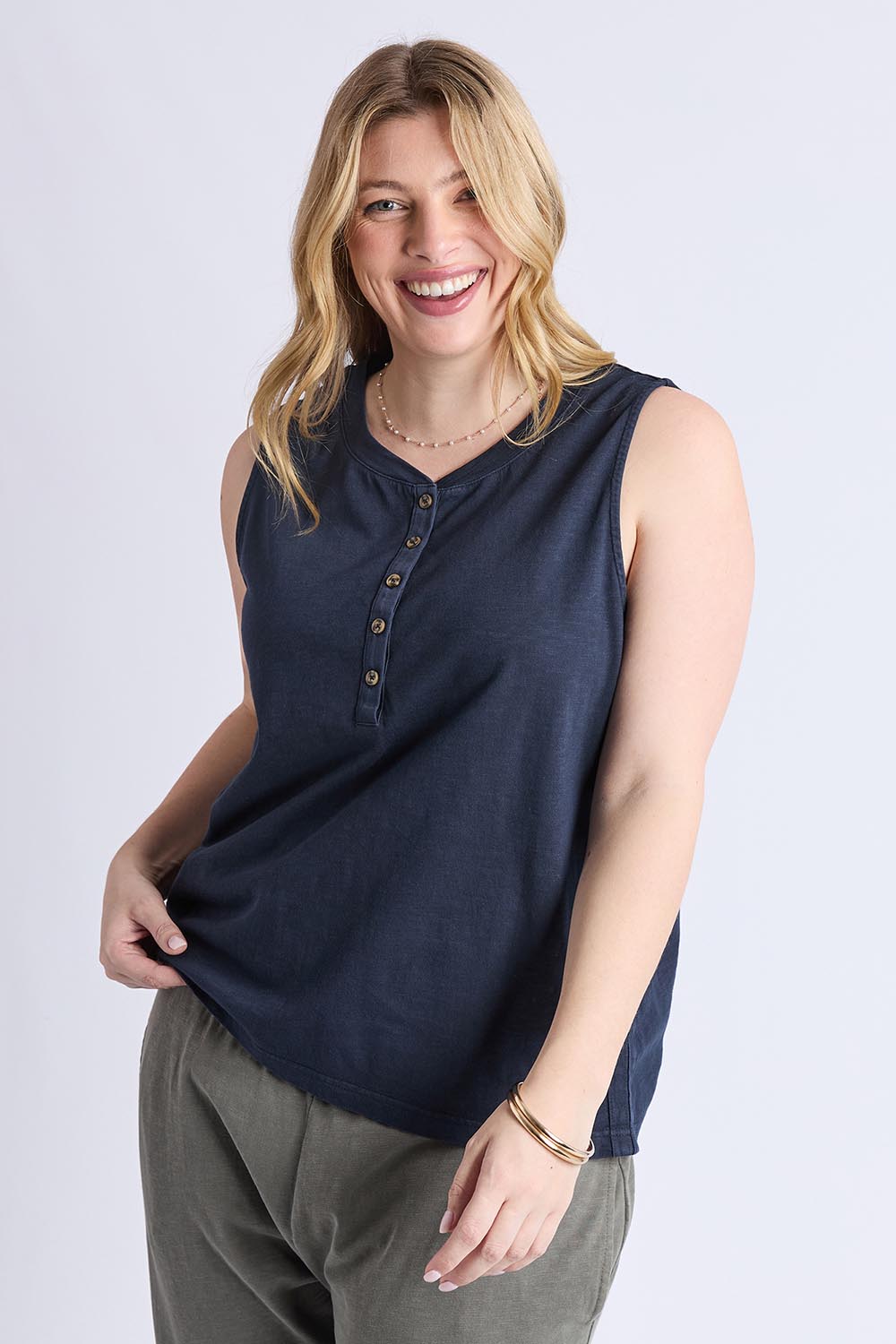 A model wearing the Fundamental Elysian Cotton Tank in colour Navy (Blue), from the front, cropped image