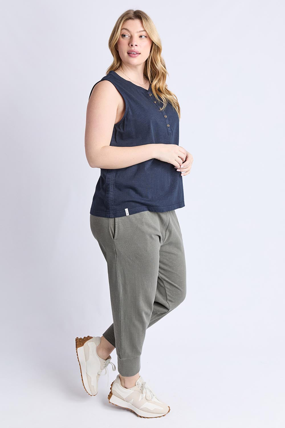 A model wearing the Fundamental Elysian Cotton Tank in colour Navy (Blue), from the front, showing the whole outfit