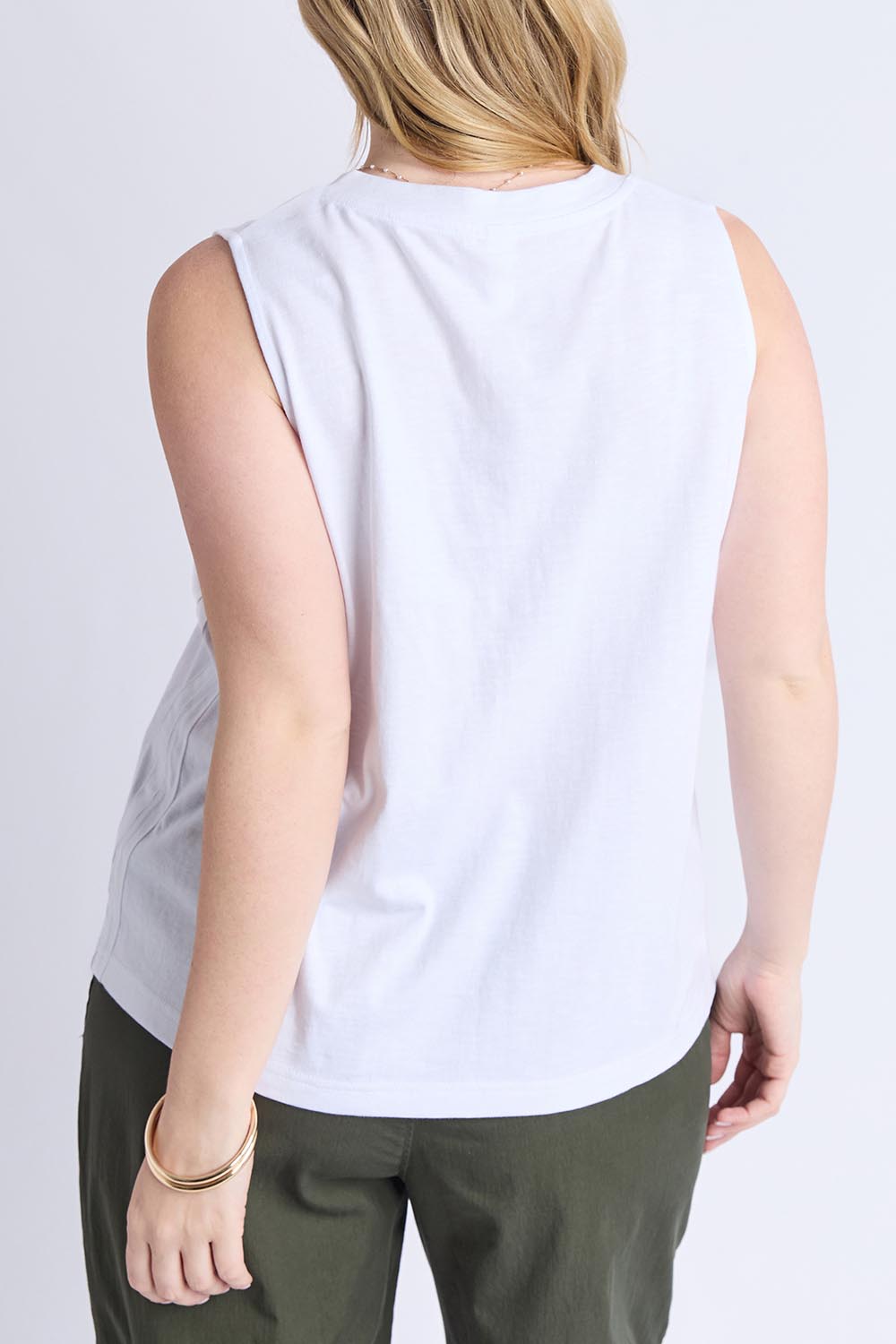A model wearing the Fundamental Elysian Cotton Tank in colour White (White), from the back